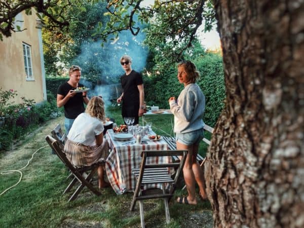 Friends having a backyard picnic