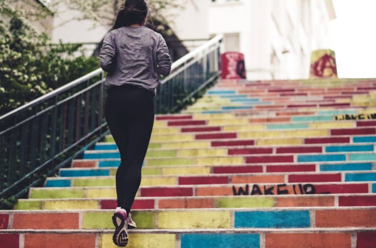 Woman jogging up the stairs