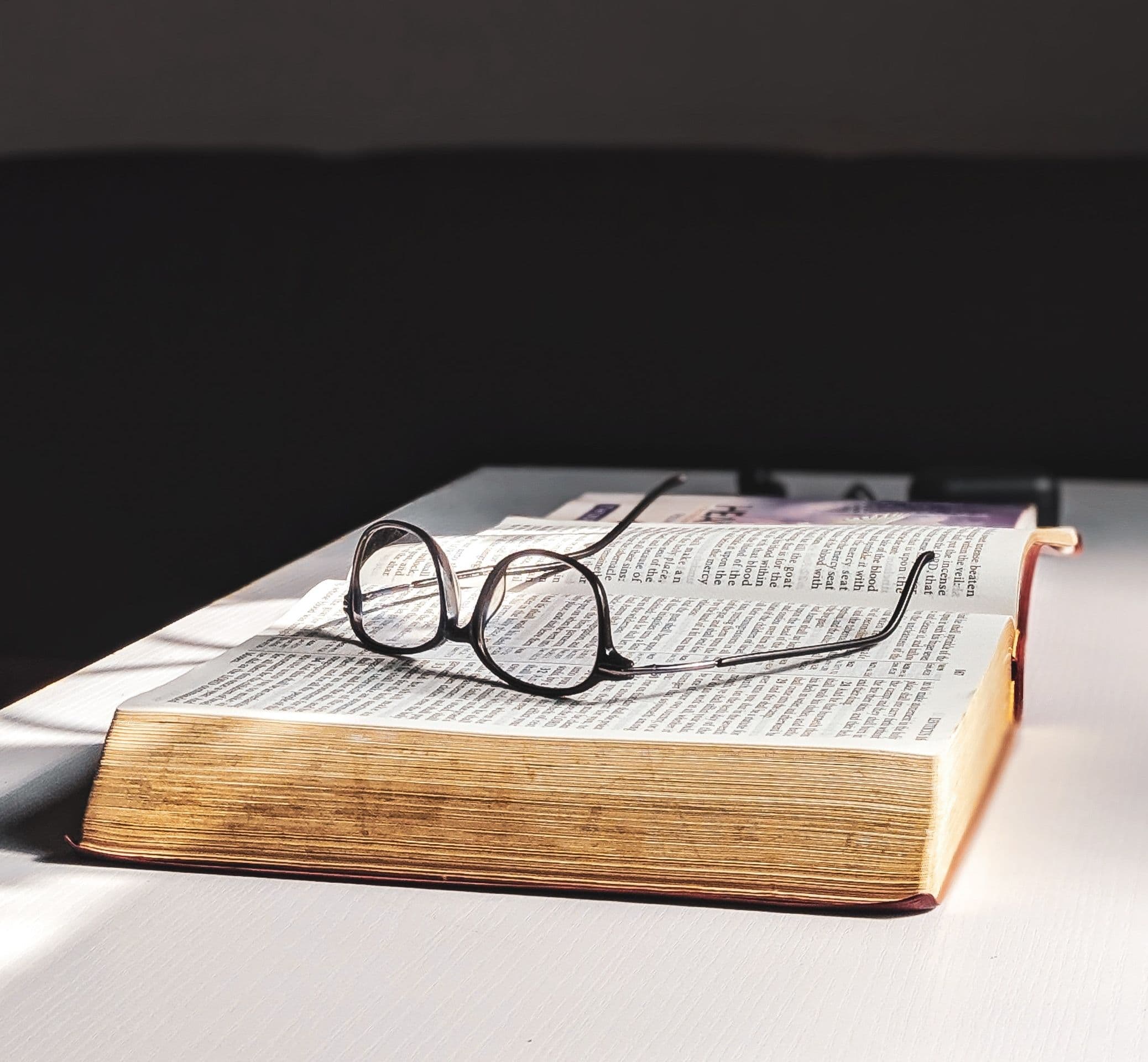 A book with glasses on top, by Oladimeji Ajegbile via Pexels