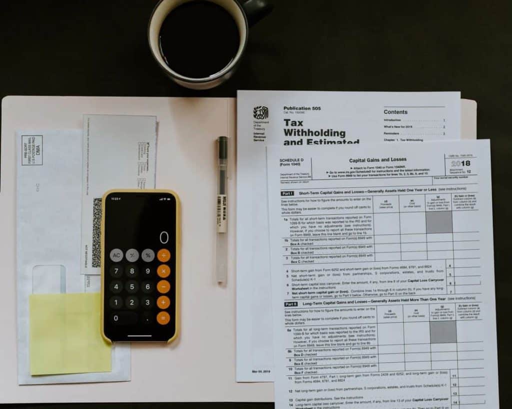 Tax paperwork, by Kelly Sikkema via Unsplash