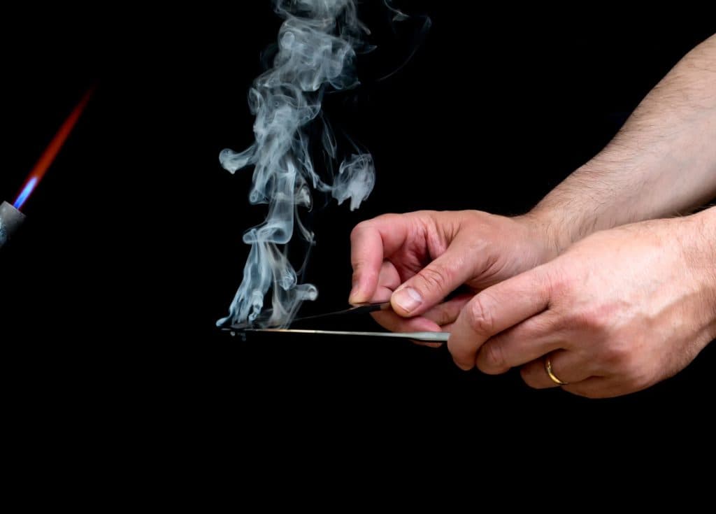 Two heated knifes, being used to smoke hashish, by madsci via iStock