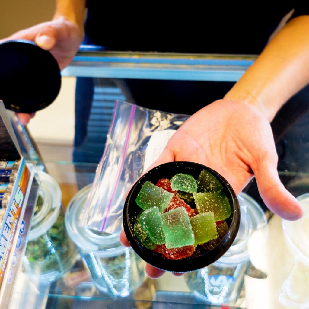 Man holding gummy edibles