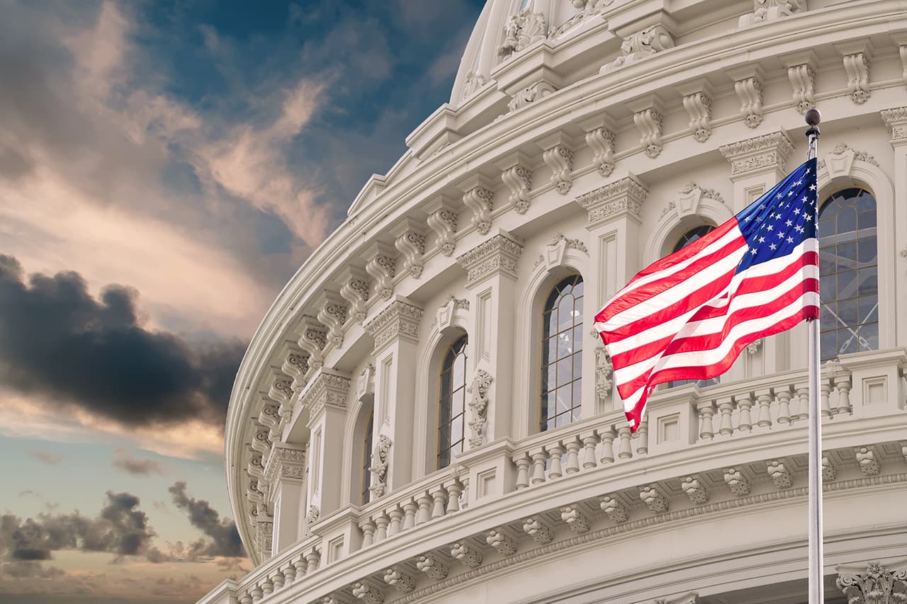 Washington DC Capitol dome detail with waving american flag