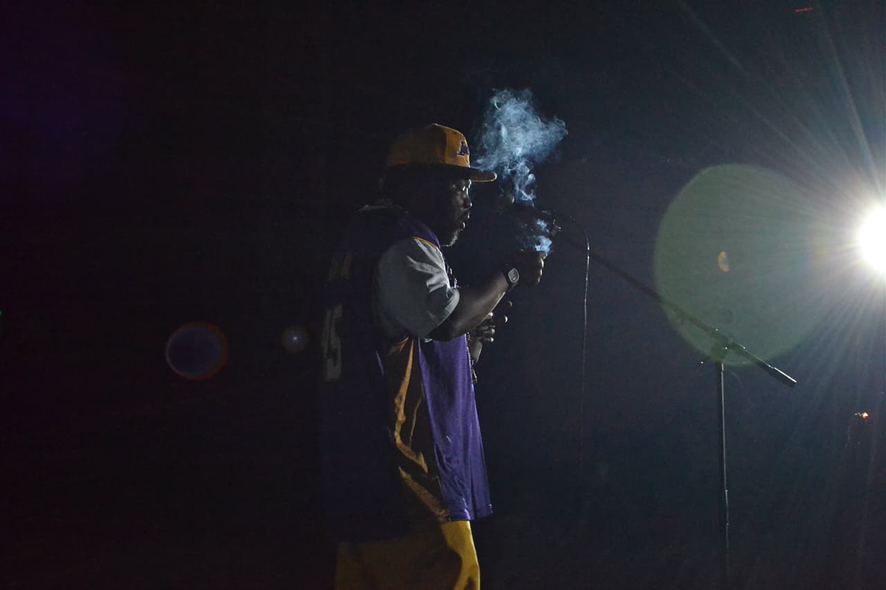 a picture of Afroman smoking on stage