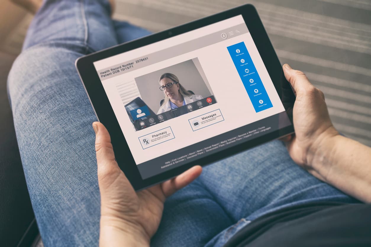 Telehealth / Telemedicine - A medical cannabis patient is having to use her computer tablet to have conference call with her doctor while she recovers at home.