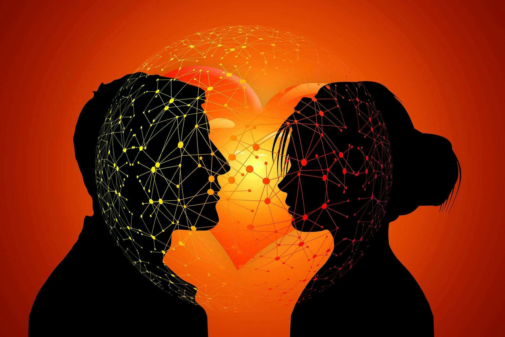 Silhouette of man and women in front of a heart making connections through electricity.