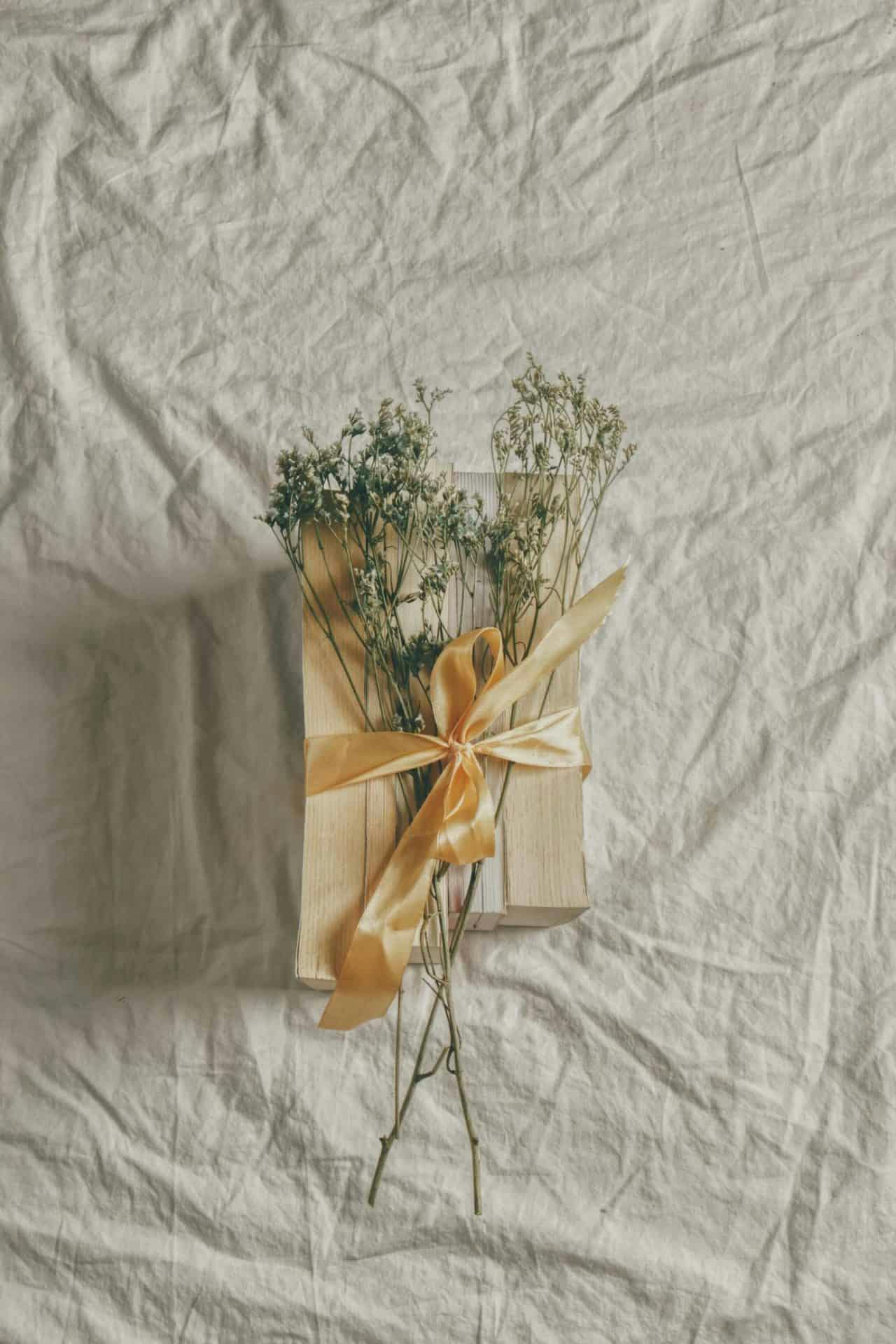 photo of a wrapped gift with plants for decoration