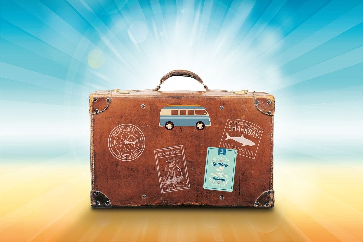 A luggage with travel stickers from Hawaii and California by stux via Pixabay