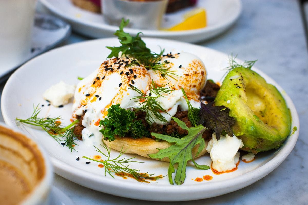 A plate of eggs and avocado, by Kyle Roxas via Pexels