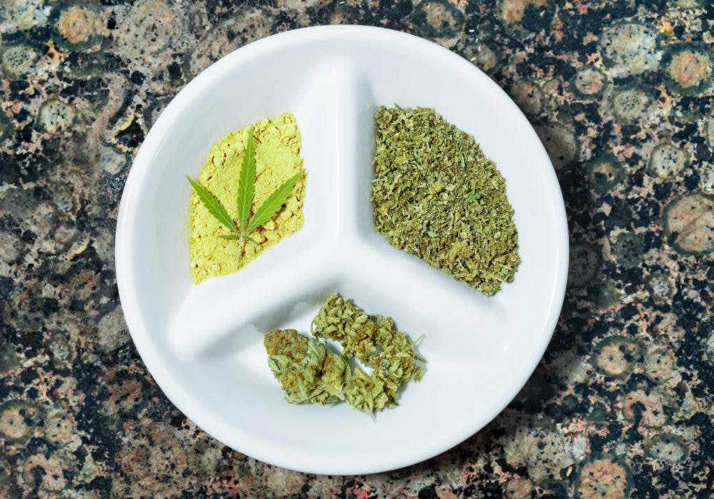 Top view of tray with different types of cannabis: kief, marijuana buds and crushed cannabis, by José Antonio Luque Olmedo via iStock