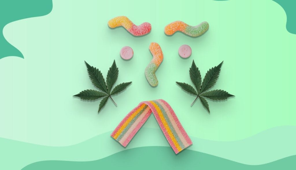 Smiley face made with cannabis leaves and candies