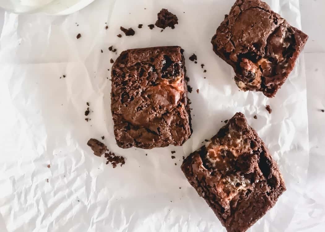three brownies on parchment paper