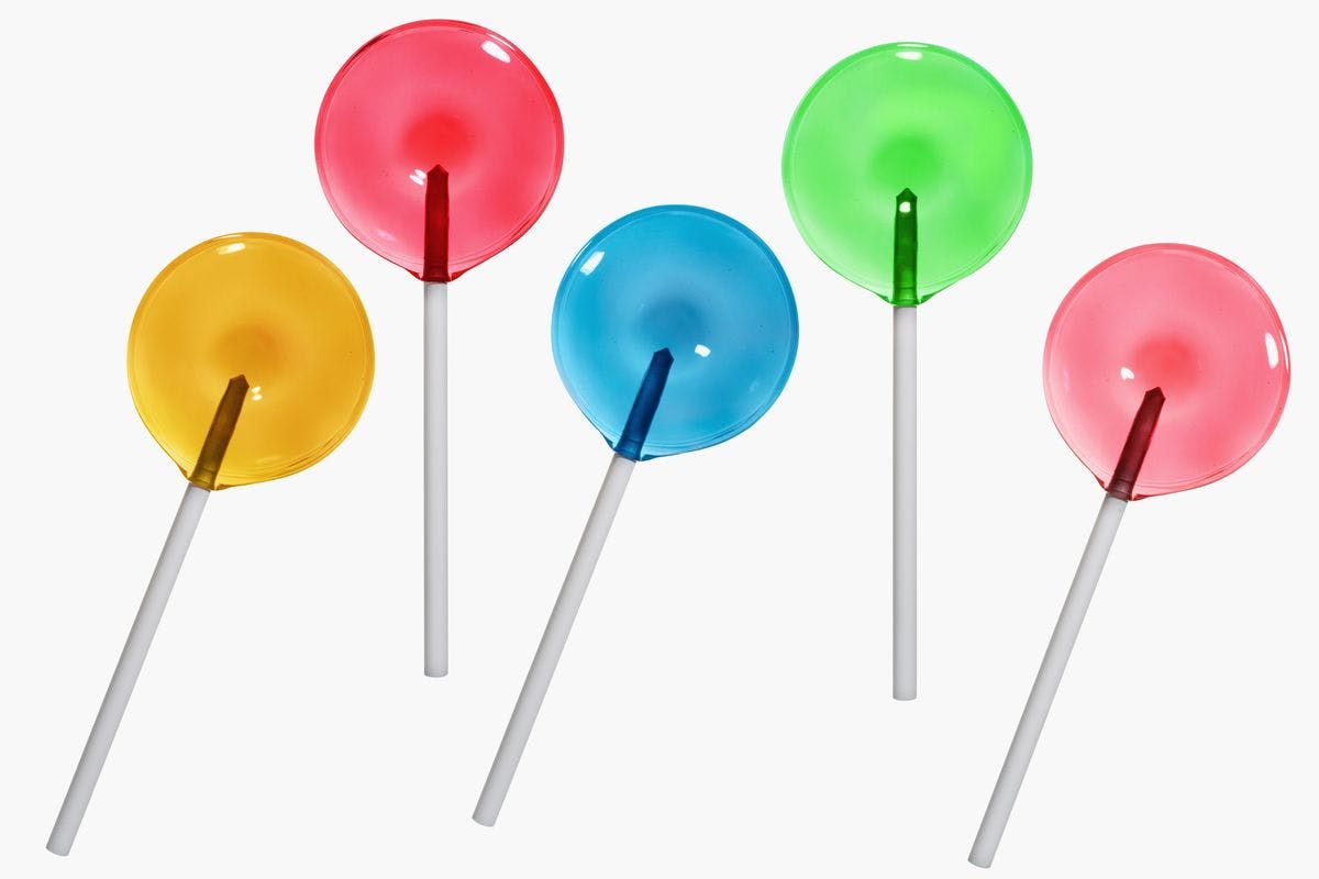 High angle view of five lollipops, by ayala_studio via iStock