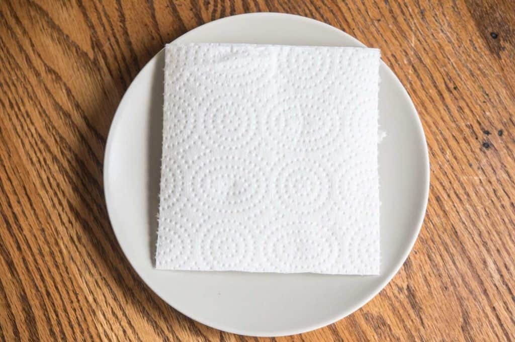 folded paper towel on plate