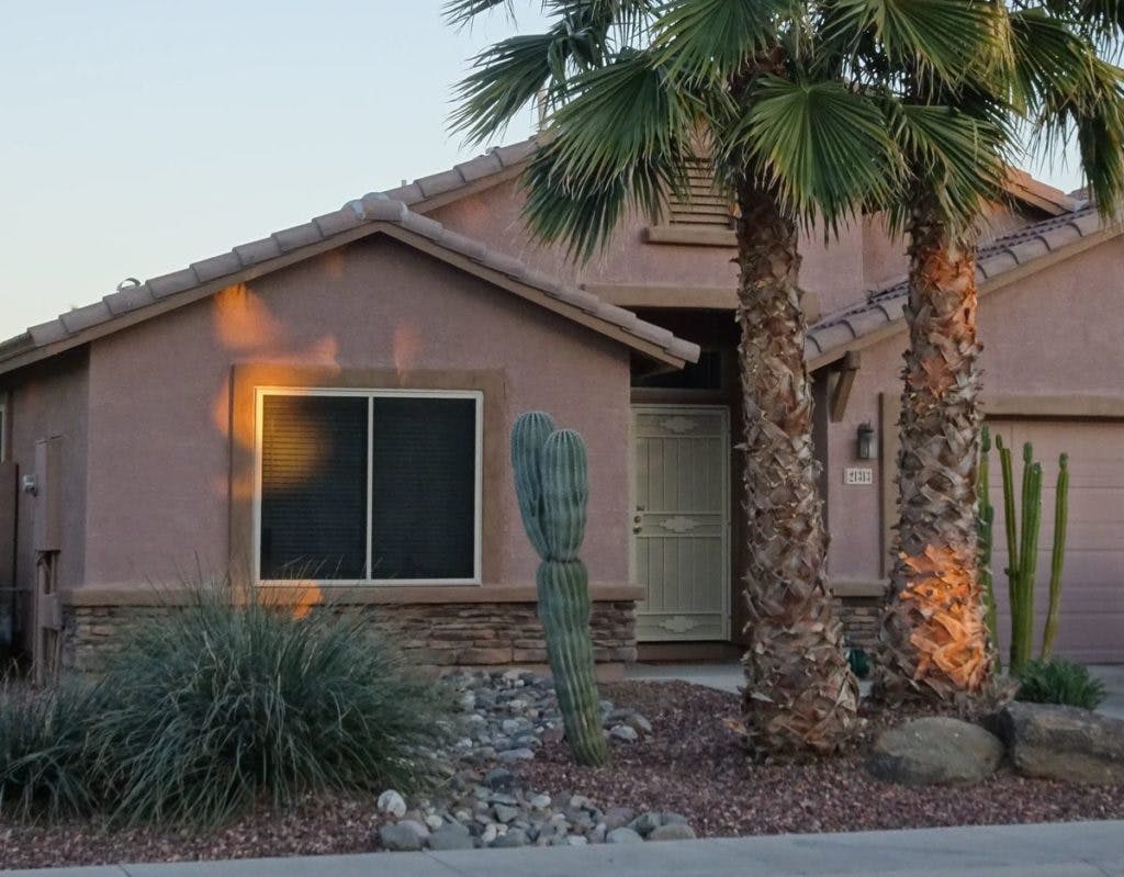 A house in Arizona, with a cactus