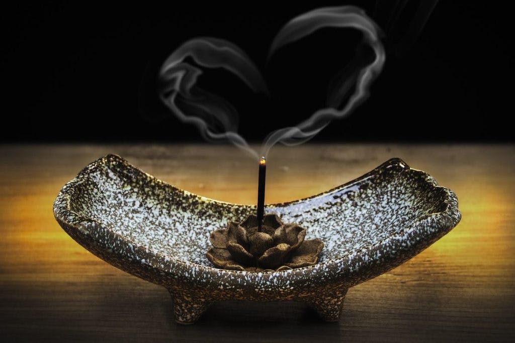 A bowl with incense stick, by truthseeker08 via pixabay