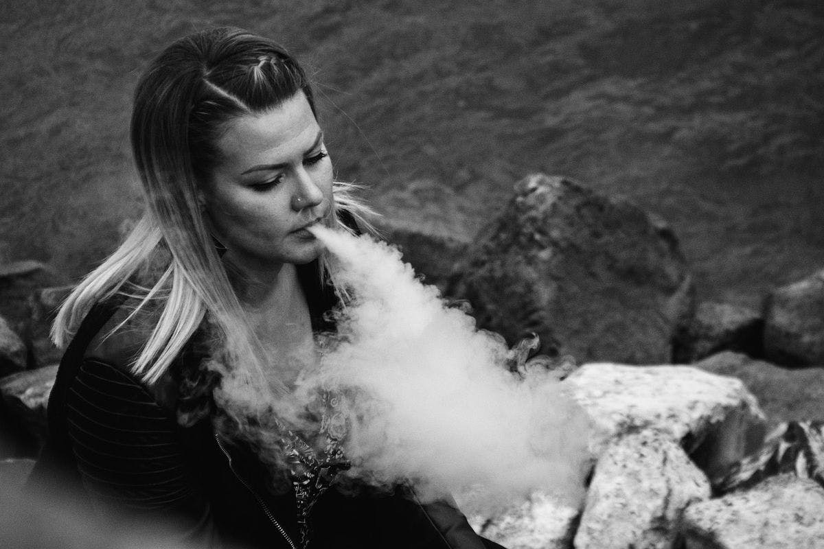 A woman exhaling a cloud of vapor, by Ernestovdp via Pixabay