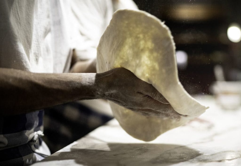 Chef prepared pizza dough, by FG Trade via iStock