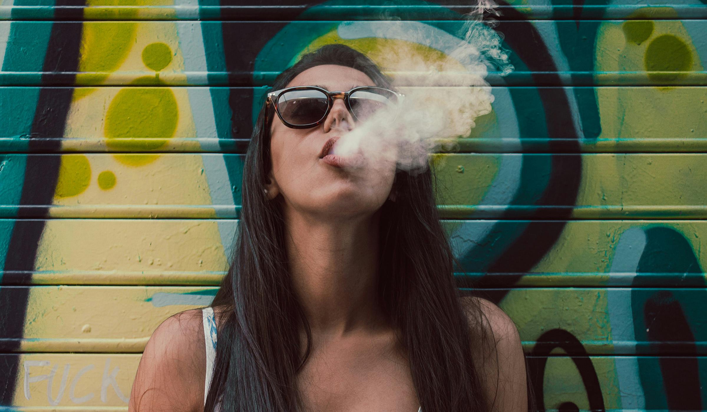 young woman smoking out joints