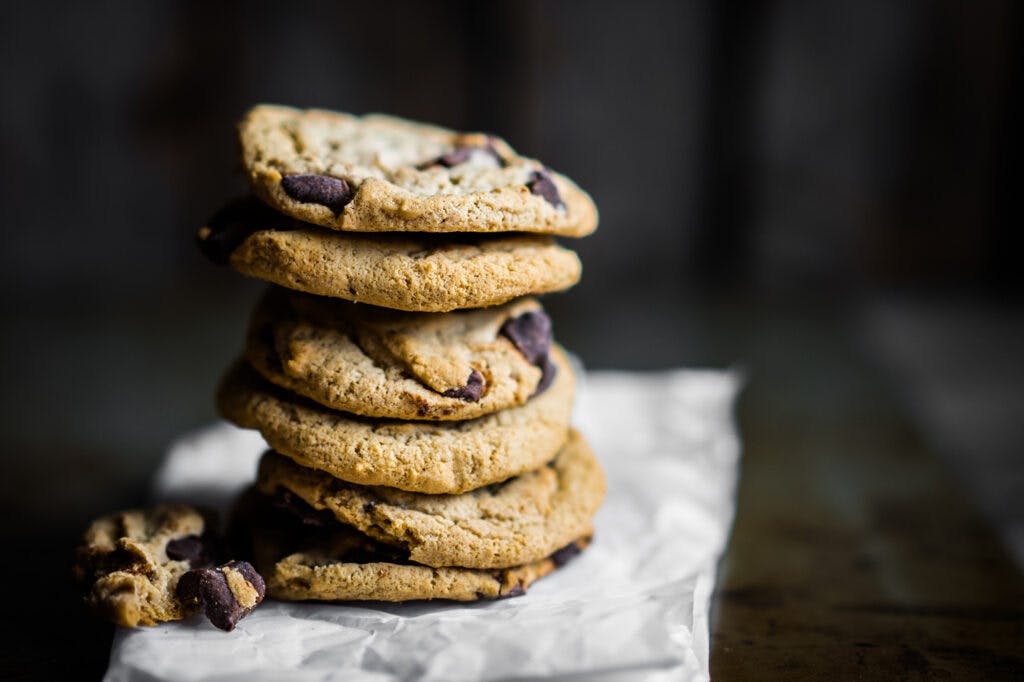 Chocolate chip cookies on rustic background