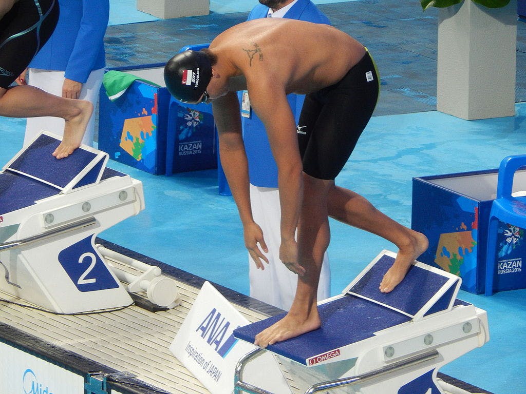 Joseph Schooling getting prepared to swim the 100 meter butterfly
