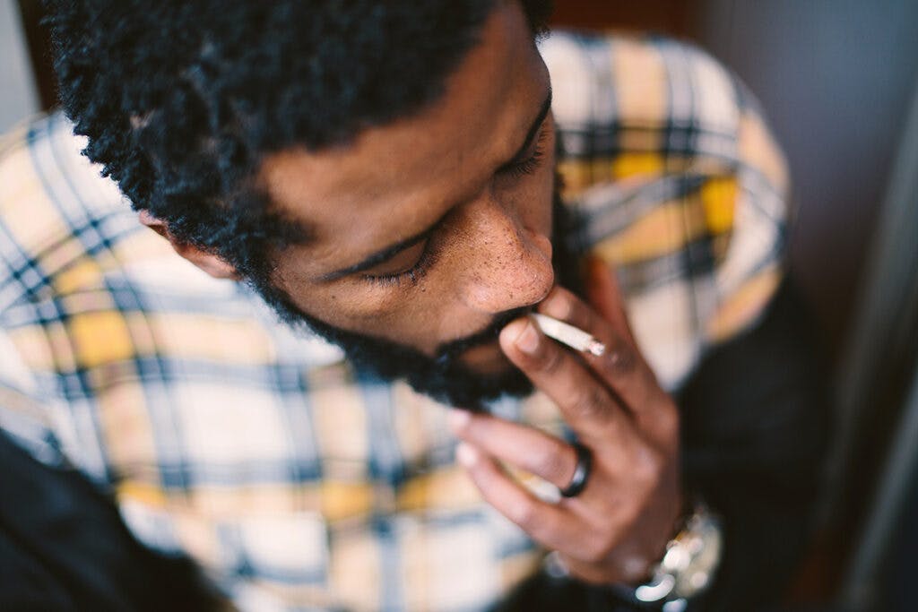 Portrait of guy smoking.